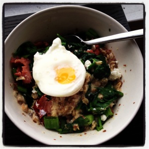 Oats wtih flax, spinach, green onion, and turkey bacon topped with goat cheese and a poached egg. 